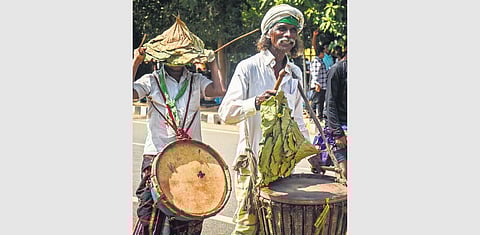 Tribal men don hats made of leaves during the protest rally demanding implementation of PESA Act, at Mahatma Gandhi Marg | DEBADATTA MALLICK