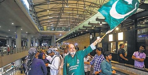 Basheer Chacha waves the Pakistan flag to welcome the team at the Rajiv Gandhi International Airport in Hyderabad on Wednesday | PTI