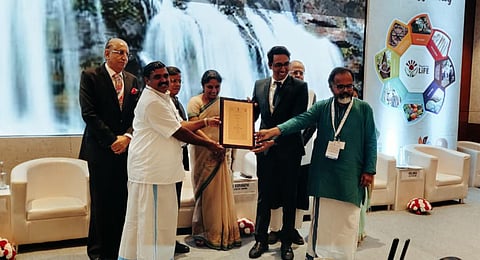 Kerala Tourism director P B Nooh and Kanthalloor panchayat president P T Mohandas receiving the award