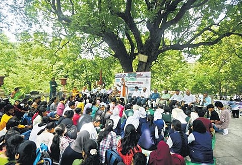 People speak during the gathering for 1908 Musi flood victims under a tamarind tree at Osmania General Hospital on Wednesday | Vinay Madapu