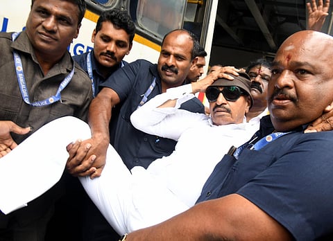 Kannada activist Vatal Nagaraj being evicted during a protest against the release of Cauvery water to Tamil Nadu, in Bengaluru on Wednesday. (Photo | Shashidhar Byrappa)