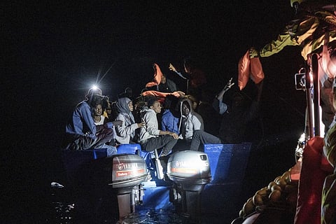 Rescuers approach a migrants' boat adrift in international waters off Malta in the Mediterranean Sea, on Oct. 25, 2022. (Photo | AP)