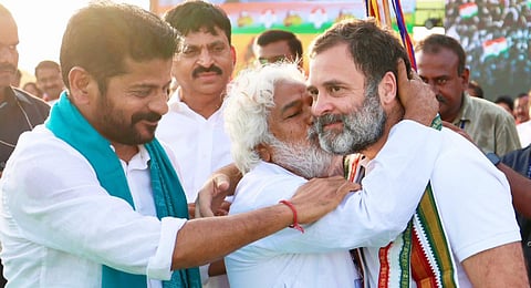 The balladeer hugs Rahul Gandhi during a rally