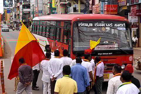 Kannada activists stop a bus during the Karnataka bandh called against release of Cauvery water to Tamil Nadu, in Chikmagalur. (Photo | PTI)