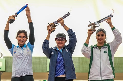Gold medal winner Indian shooter Palak with silver medallist compatriot Esha Singh (L) and bronze medallist Pakistan's Kishmala Talat. (Photo | PTI)