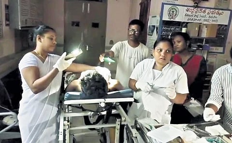 The medical staff of Kurupam CHC giving first aid to road accident victims under torchlight during a power outage on Friday night | Express