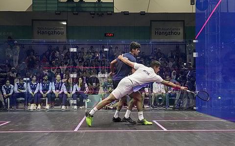 India's Abhay Singh and Pakistan's Noor Zaman during the final of Men's Team squash event at the 19th Asian Games, in Hangzhou. (Photo | PTI)