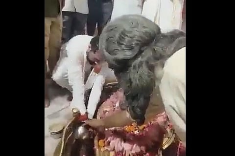 UP Minister Satish Sharma seen watching his hands at a shivling in a temple (videograb)