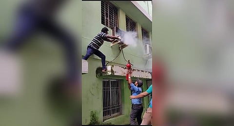 Hospital staff and fire personnel try to douse the fire at the MCHÂ | Express