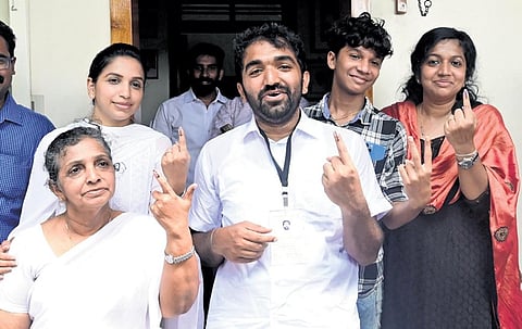 UDF candidate Chandy Oommen, his mother Mariamma Oommen, sisters Maria and Achu Oommen after casting their votes at Georgian Public School in Puthuppally on Tuesday | Vishnu Prathap