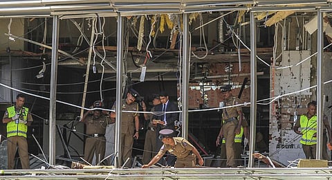 FILE- In this April 21, 2019, file photo, Sri Lankan police officers inspect the site of an explosion at the Shangri-la hotel in Colombo, Sri Lanka. (Photo | AP)