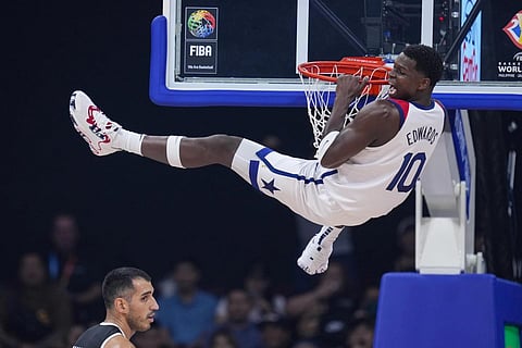 US guard Jalen Brunson reacts after a dunk over Jordan center Ahmad Dwairi during the first half of a Basketball World Cup match in Manila, Aug 30, 2023. (Photo | AP)