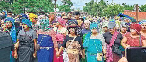 Hundreds of women defy curfew and stage a protest at Phougakchao Ikhai, in Manipur’s Bishnupur district on Wednesday. (Photo | PTI)