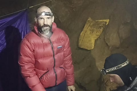 American caver Mark Dickey, left, 40, talks to a colleague inside the Morca cave near Anamur, southern Turkey, Thursday, Sept. 7, 2023. (AP)