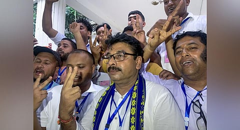 BJP candidate Tafajjal Hossain shows victory sign after his win in the Boxanagar assembly bypoll. (Photo | PTI)