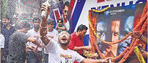 Shah Rukh Khan fans celebrate at a cinema hall | PTI