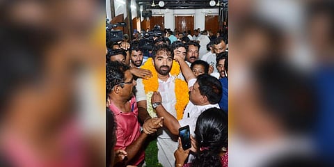 UDF candidate Chandy Oommen celebrates after a humongous victory with a record margin of 36,454 votes. (Photo | Express)