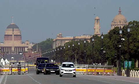 A convoy moves past at Kartavya Path during full dress carcade rehearsal for the upcoming G20 Summit, in New Delhi. (Photo | PTI)