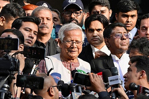 Bangladeshi Nobel peace laureate Muhammad Yunus (C) leaves a court in Dhaka on January 1, 2024. (Photo | AFP)