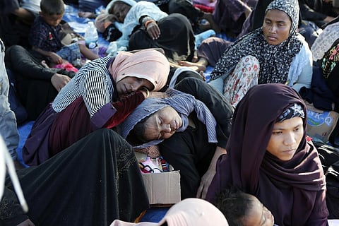 Ethnic Rohingya women rest under a tent after landing on a beach in Kuala Besar, North Sumatra, Indonesia. (Photo | AP)
