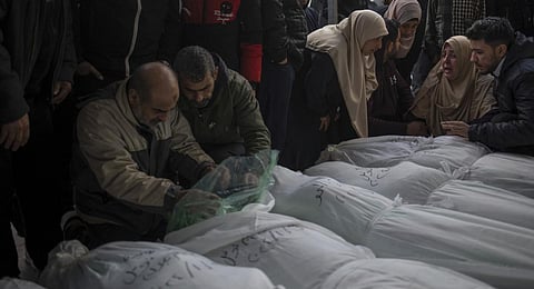 Palestinians mourn their relatives killed in the Israeli bombardment of the Gaza Strip, outside a morgue in Rafah, southern Gaza. (Photo | AP)