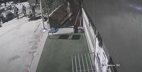 Israeli soldiers surround three men they shot, in the occupied West Bank village of Beit Rima. (Photo | AP)