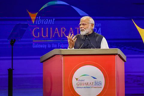 Prime Minister Narendra Modi addresses during the Vibrant Gujarat Global Summit 2024, in Gandhinagar. (Photo | PTI)
