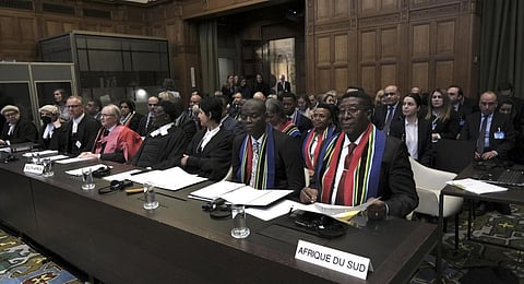 Ambassador of the Republic of South Africa to the Netherlands Vusimuzi Madonsela, front right, and Minister of Justice and Correctional Services front second right, during the opening of the hearings.