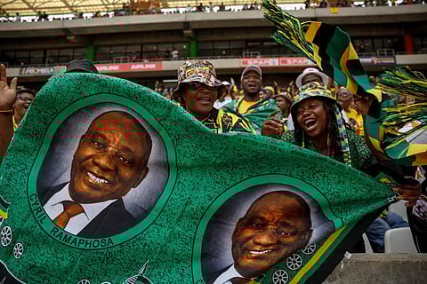 African National Congress (ANC) supporters hold a fabric with a picture of South African President Cyril Ramaphosa during a rally in Mbombela on January 13, 2024. (Photo | AFP)