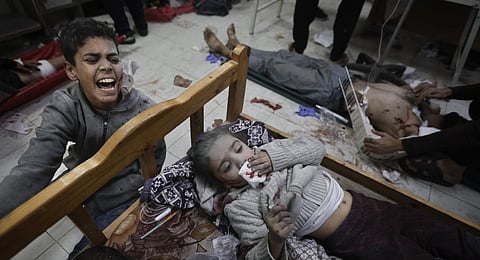 Palestinians children wounded in the Israeli bombardment of the Gaza Strip arrive at a hospital in Khan Younis. (Photo | AP)