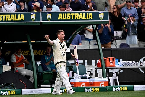 Australia's David Warner waves to the fans after being dismissed on the third day of the second cricket Test match between Australia and Pakistan in Melbourne on December 28, 2023. (Photo | AFP)