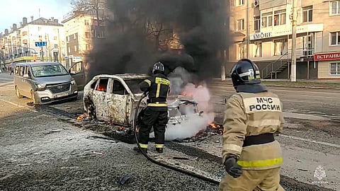 Firefighters extinguish burning cars after shelling in Belgorod, Russia. (Photo| AP)