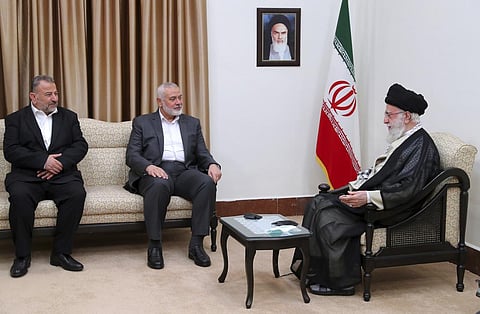Saleh Arouri (left) and Hamas leader Ismail Haniyeh (centre) meeting Iranian leader Ayatollah Ali Khamenei in Tehran in June 2023 (Photo | AP)