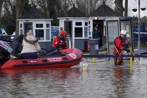 Northamptonshire Fire and rescue service rescue people from houseboats after the pathway to land was blocked due to rising water caused by Storm Henk. (Photo| AP)