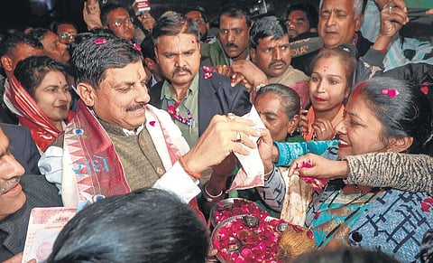 CM Mohan Yadav distributes ‘Akshat’ rice grains ahead of Ram Temple event | pti