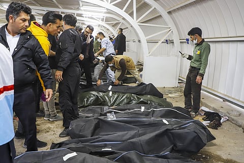 The bodies of victims died from the twin explosion in Iran. (Photo | AFP)