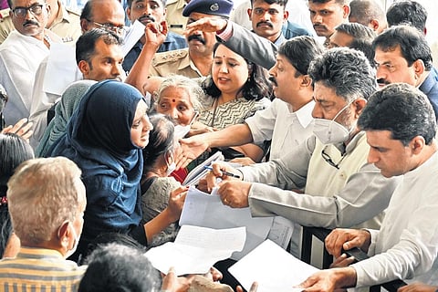 Deputy CM DK Shivakumar and Urban Development Minister Byrathi Suresh during the ‘Government at your Doorstep’ programme in Ulsoor on Saturday | Express