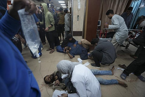Palestinians wounded in the Israeli bombardment of the Gaza Strip are brought to Al Aqsa hospital in Deir al Balah, Gaza Strip, Sunday, Jan. 7, 2024. (Photo | AP)