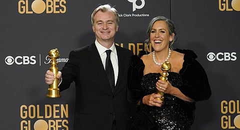 Christopher Nolan, left, and Emma Thomas pose in the press room with the award for best motion picture, drama for 'Oppenheimer' at the 81st Golden Globe Awards.(Photo | AP)