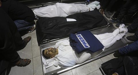 The body of a Palestinian journalist Akram Al-Shafi'i killed in the Israeli bombardment of the Gaza Strip, lies in a morgue of the European Gaza Hospital in Rafah. (Photo | AP)