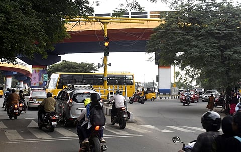 More than a month after pedestrian crossing signals were installed at Sungam junction on Trichy road in Coimbatore city, the signals have not been brought to usage. (Photo | S Senbagapandiyan, EPS)
