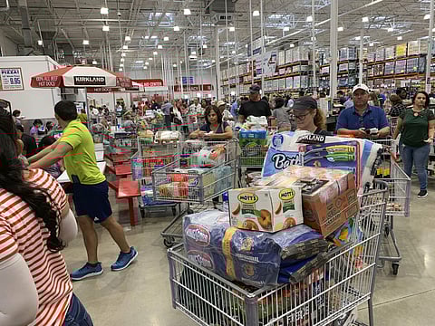 Shoppers wait in long lines at a Costco store in the US