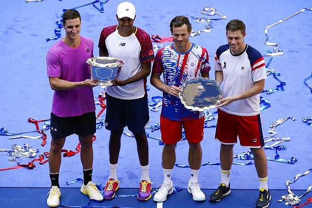 Joe Salisbury (Britain), Rajeev Ram (United States), Wesley Koolhof (Netherlands), and Neal Skupski (Britain) pose for photos with the trophy at the the US Open tennis championships. (Photo | AP)