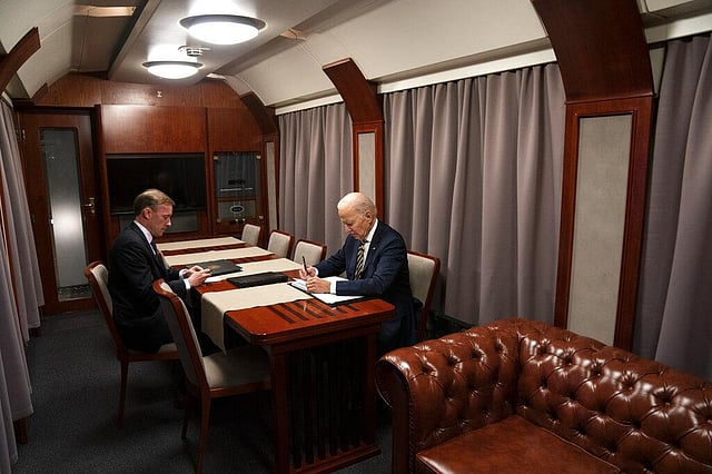 US President Joe Biden sits on a train with NSA Jake Sullivan as he goes over his speech marking the one-year anniversary of the war in Ukraine after a surprise visit with Ukrainian President Volodymyr Zelenskyy, Monday, Feb. 20, 2023, in Kyiv. (Photo | AP)