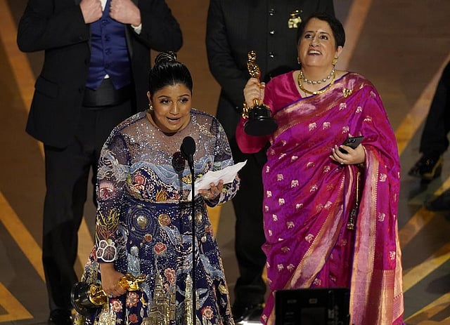Kartiki Gonsalves, left, and Guneet Monga accept the award for best documentary short film for