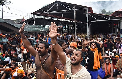 Devotees protest at the foot of the sacred 'Padhinettampadi' against the two women who attempted to enter Sabarimala hill shrine on October 19, 2018. (Photo | BP Deepu/ EPS)