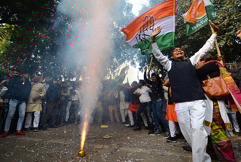 Congress supporters celebrating outside AICC in New Delhi on Tuesday (Photo | EPS/Naveen Kumar)