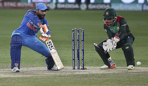 India's Ravindra Jadeja, left, bats during the final one day international cricket match of Asia Cup between India and Bangladesh. (AP)