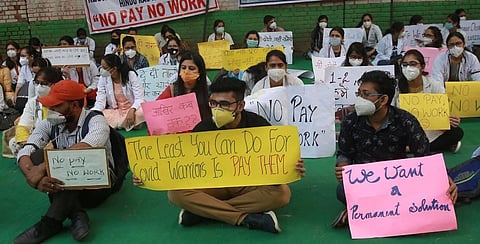 Resident doctors from the government-run hospitals take part in a demonstration demanding for their salaries to be paid on time in New Delhi. (Photo | Shekhar Yadav/EPS)