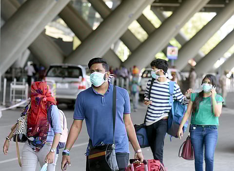 Passengers wear masks as preventive against coronavirus at Chennai Airport on Thursday. (Photo | Martin Louis/EPS)